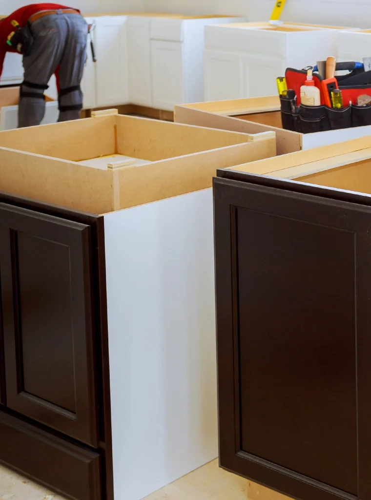 Kitchen cabinets being installed during a home remodeling project