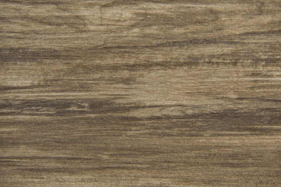 Brown wood flooring texture showcasing natural grain and warm tones.
